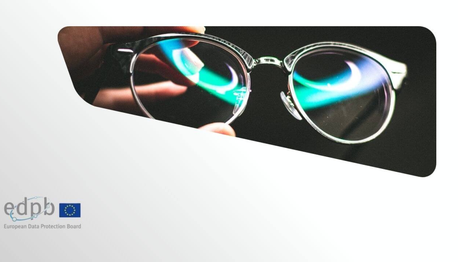 A hand holding glasses with coloured reflections in the lenses, alongside the European Data Protection Board logo.
